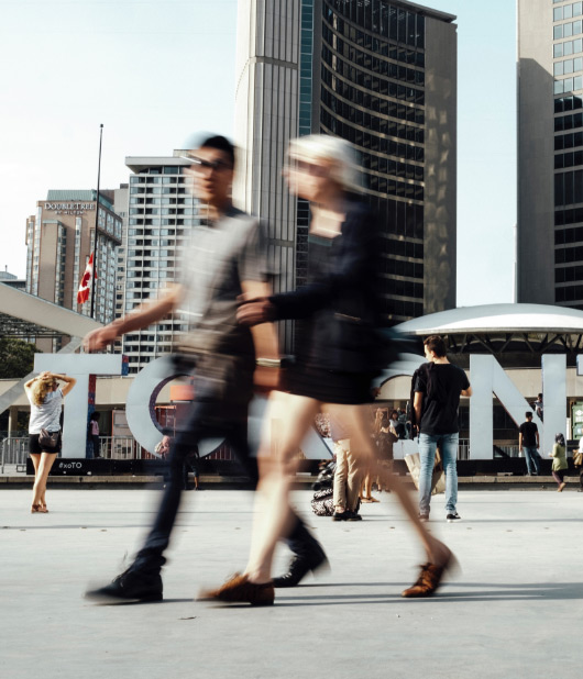 Pedestrians in front of Toronto city hall
